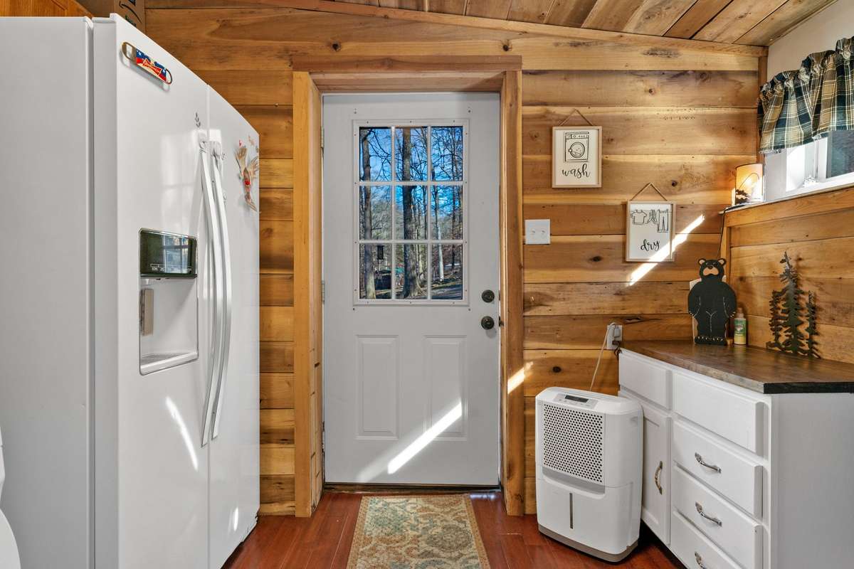 Laundry Room: Washer/Dryer, 2nd Refrigerator w/water dispenser to remain.