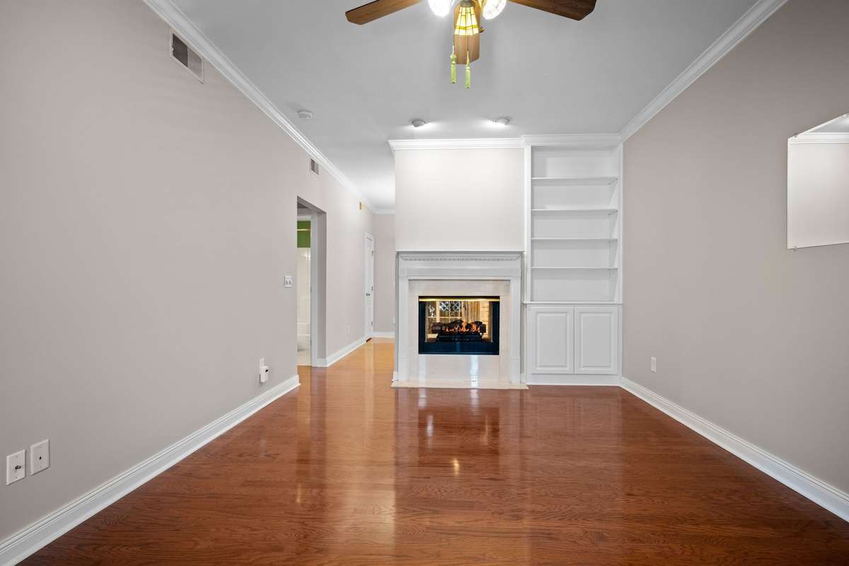 Living Room with Fireplace & Book Shelves