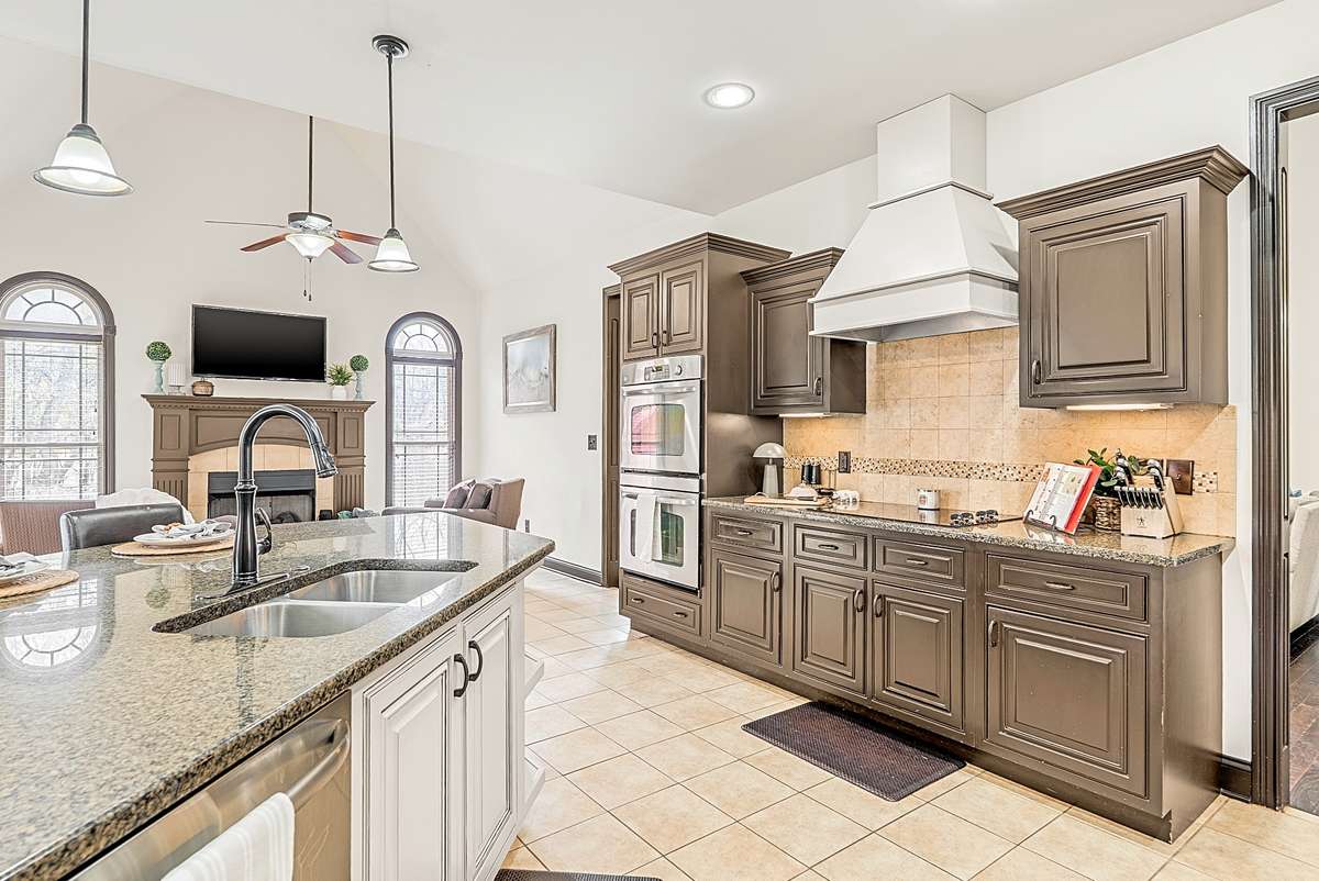 Open Kitchen with fireplace sitting area and eat in dining area