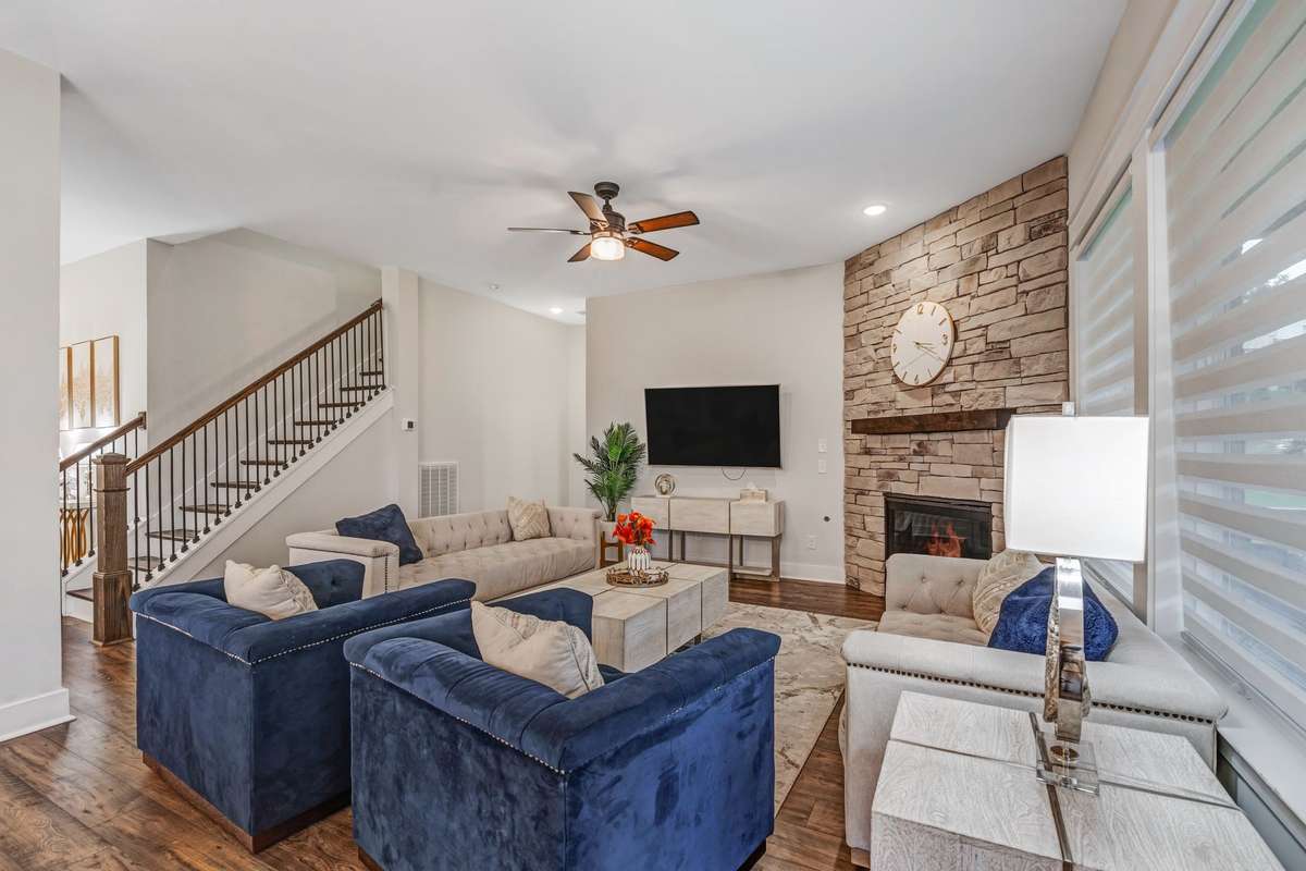 Slat stone around fireplace, Iron spindles in stairway