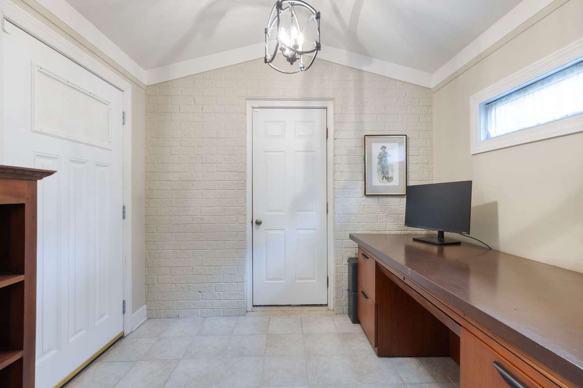 Office off the living room leading to the garage - is all one level