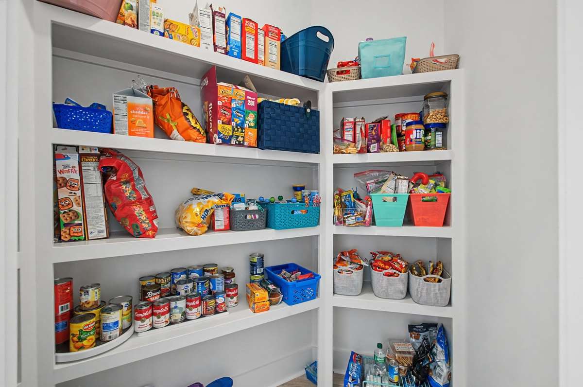 Nice pantry with wooden shelves