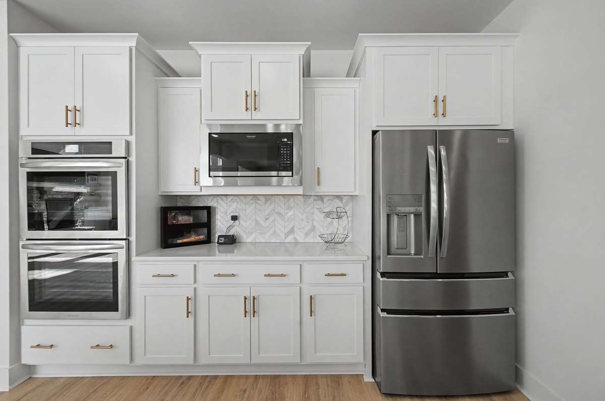 Double ovens, built in microwave, refrigerator plus lots of cabinets and drawers-All Stainless steel appliances!