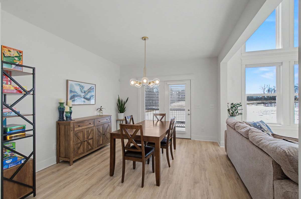 casual eating area in kitchen opens to screened in porch