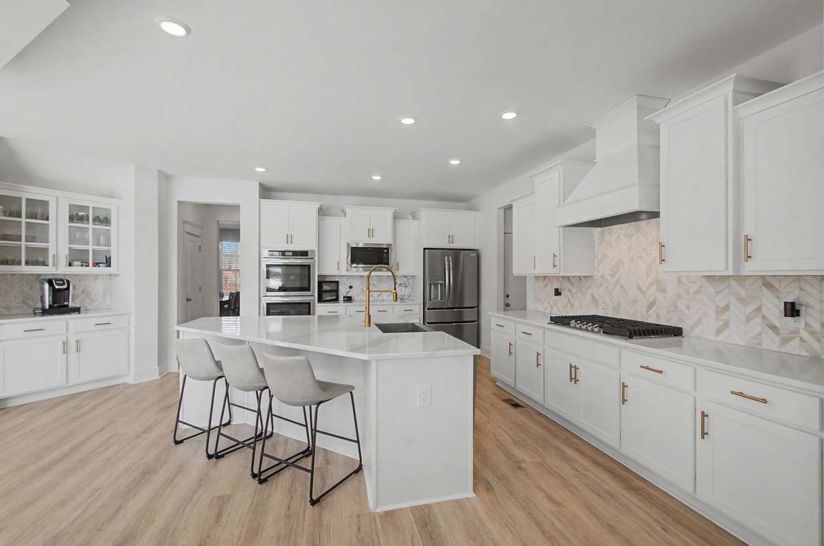 extra section with glass door cabinets-coffee bar? The tiled backsplash is so pretty!