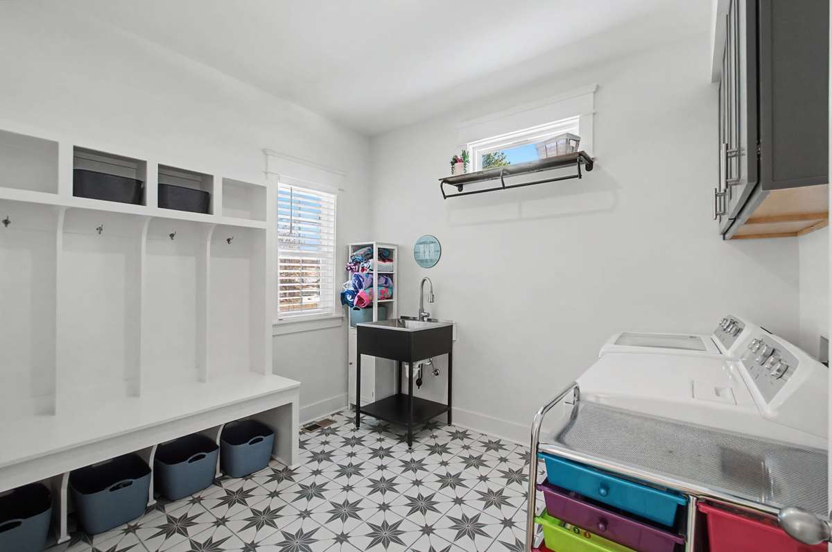 Utility room off of garage has sink and drop zone!