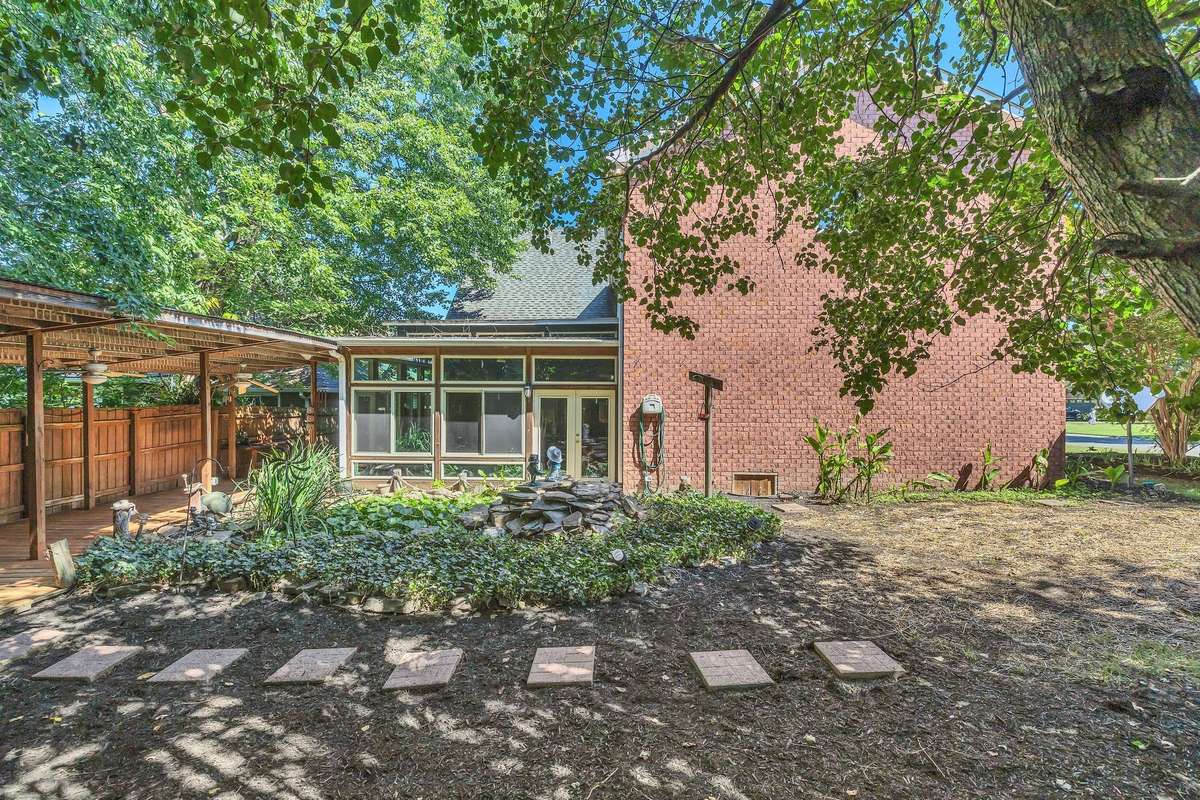 View directly behind the home.  Koi pond does not have Koi.  It's directly behind the sunroom.