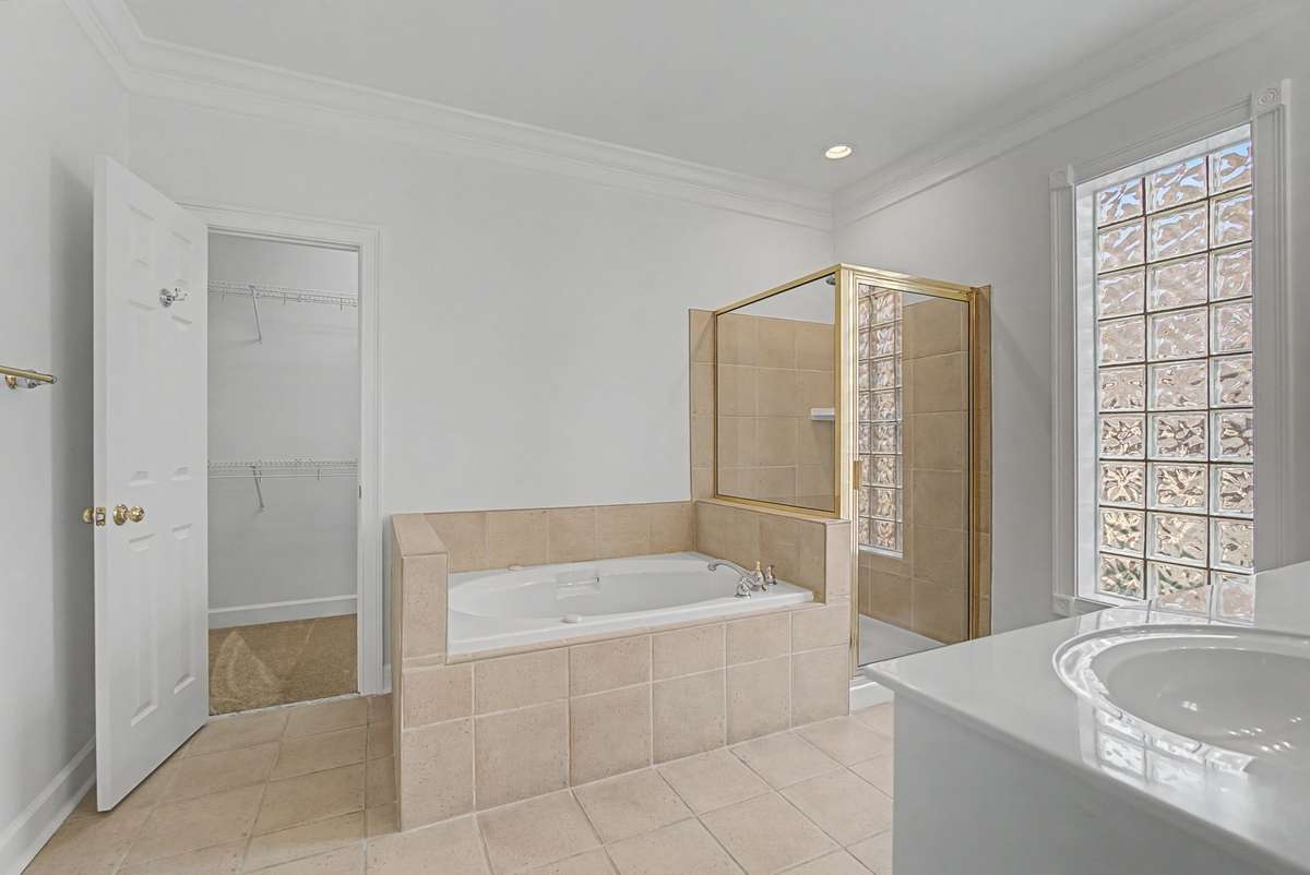 Bathroom also has a large walk-in closet.