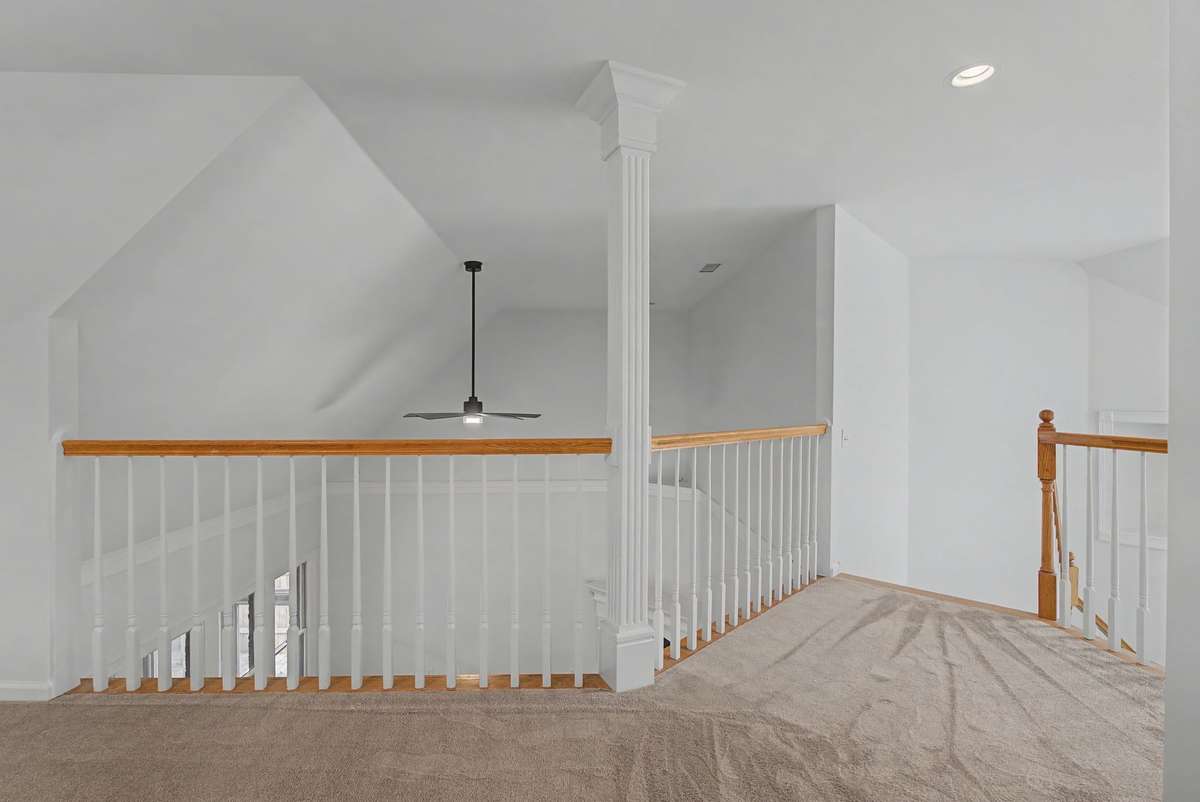 Upstairs you are greeted with spacious loft which would be great for an office or additional gathering room. All carpet upstairs is new.