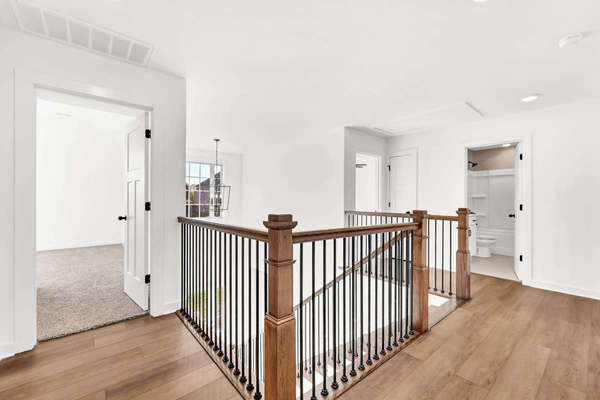 Bonus room to the left + 4 bedrooms and 2 bathrooms upstairs!