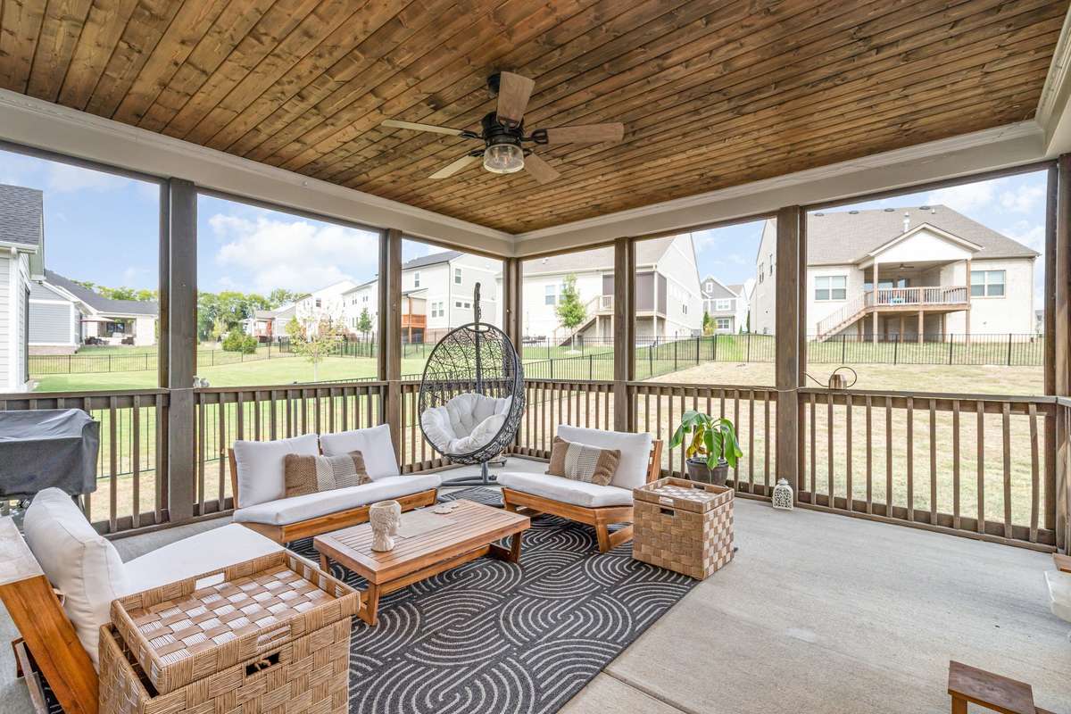 An expansive outdoor living room designed for year-round dining and entertaining in style.