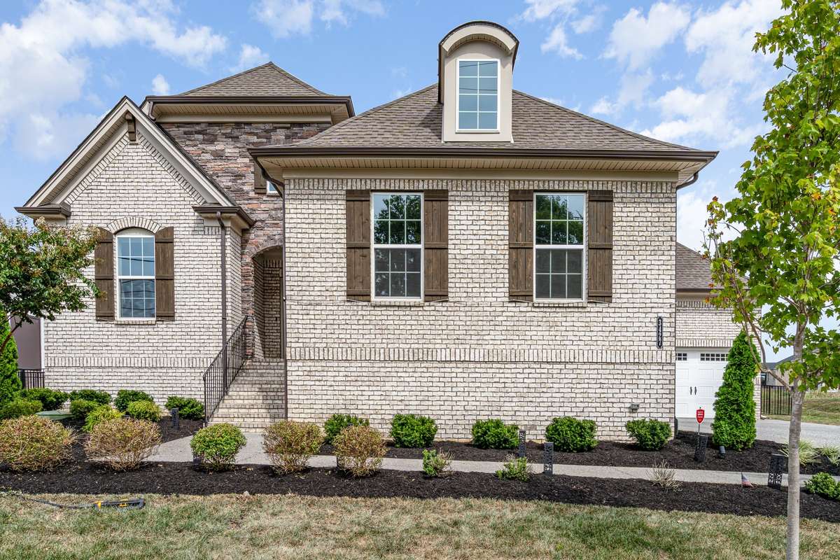 Masterfully crafted all-brick home with a rare 2+1 garage layout, premium large lot, designer upgrades.