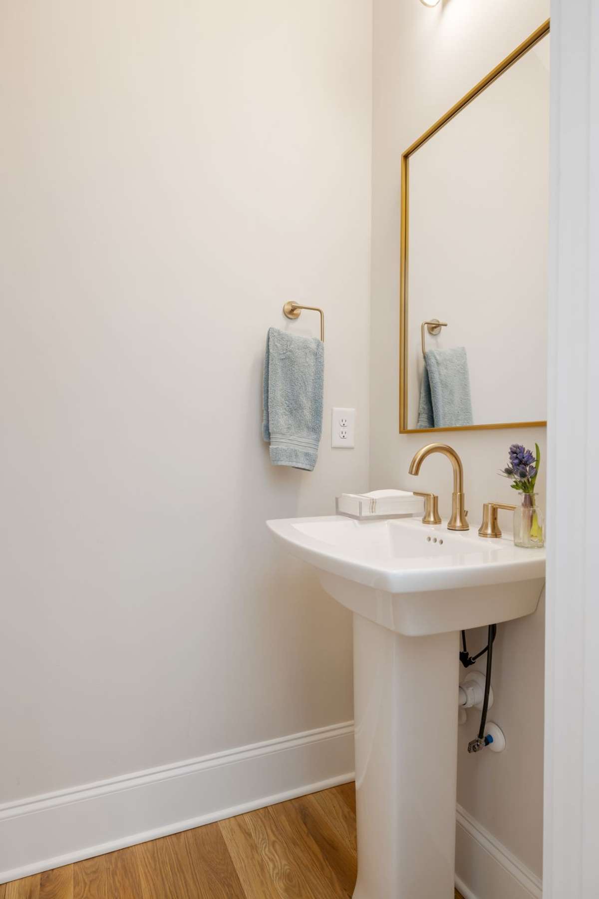 Half bath under the floating stair case.