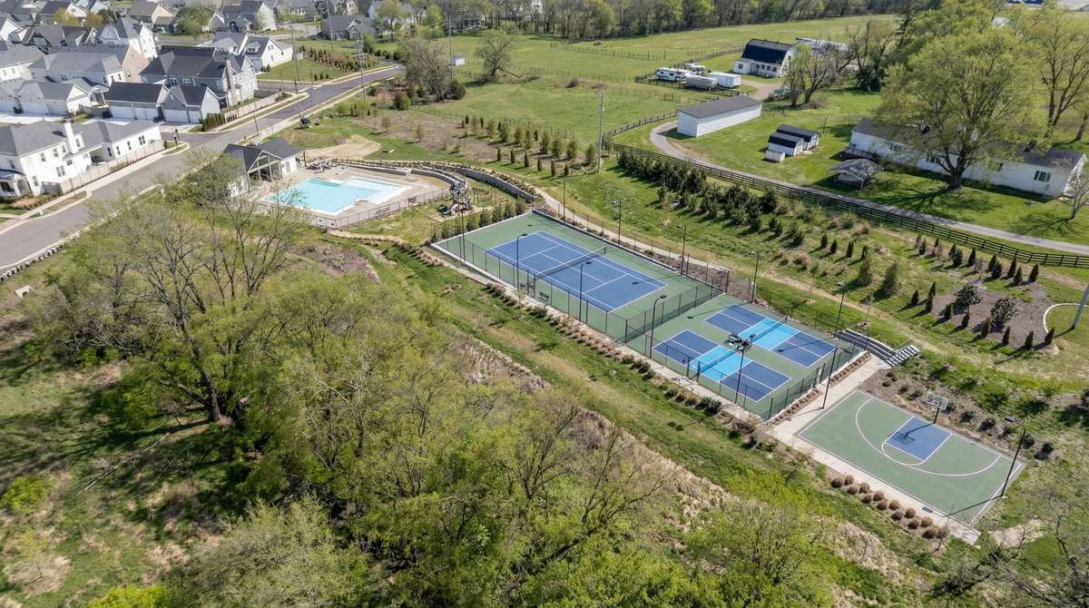 Amenities are a very short walk around the corner. Neighborhood amenities include covered bus stop, pool, cabana area, tennis court, pickle ball court, basketball court, and playground.
