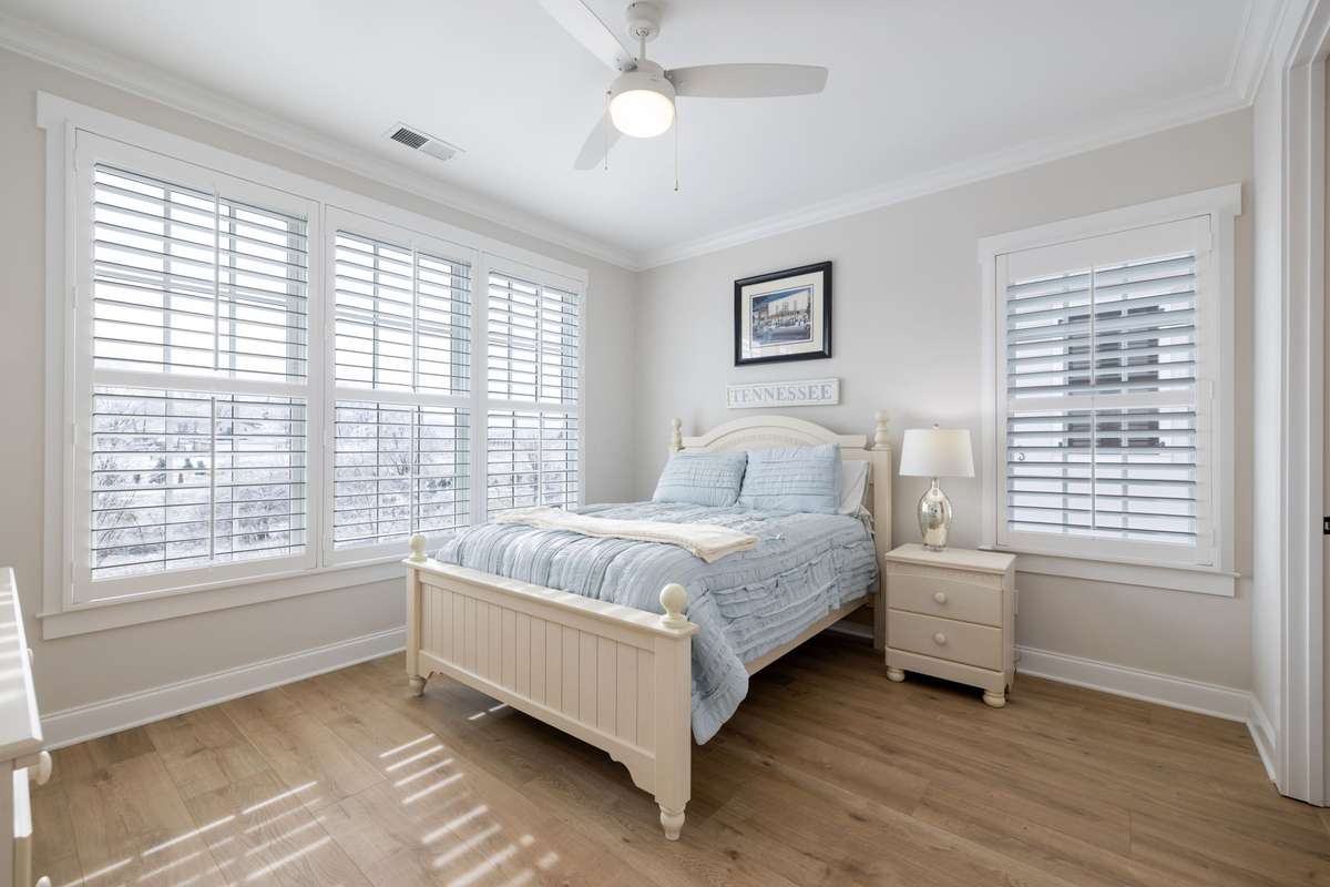 Bedroom 3 at the top of the stairs has an ensuite bath and beautiful views of the farm across the street.