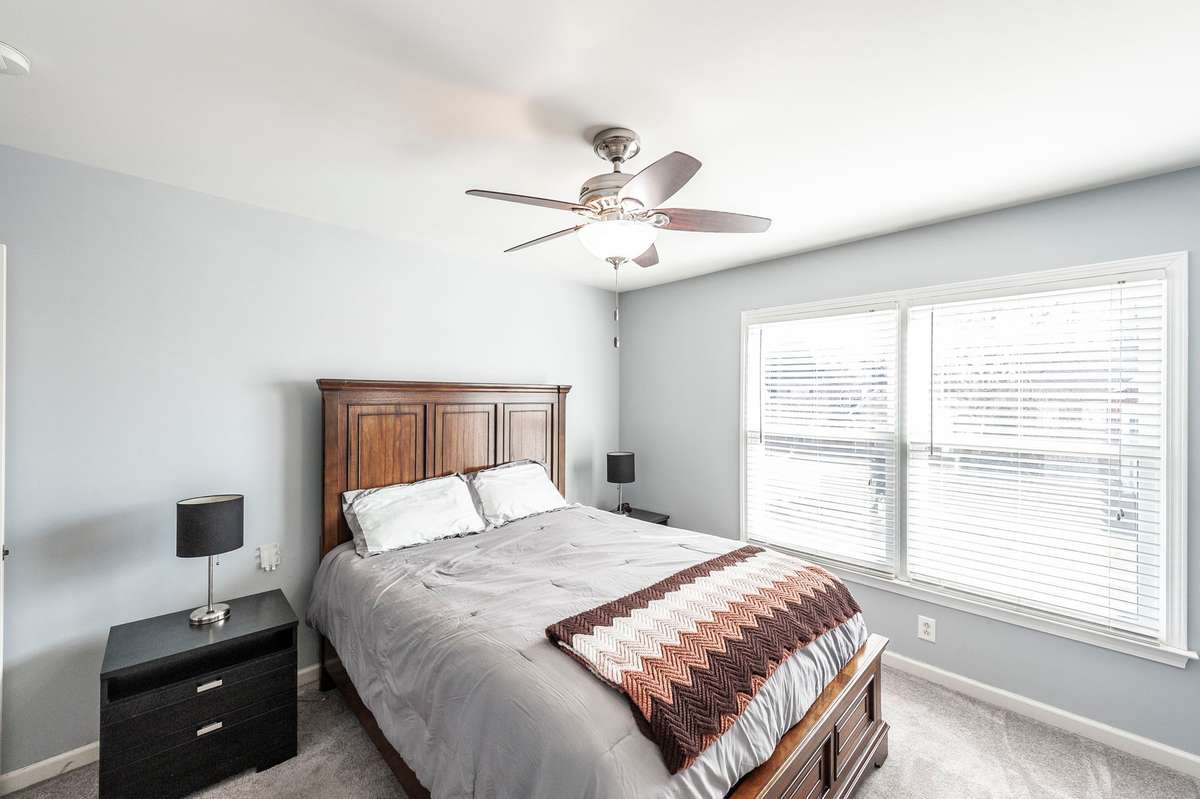 Bedroom overlooking the front of the home - features beautiful natural light !
