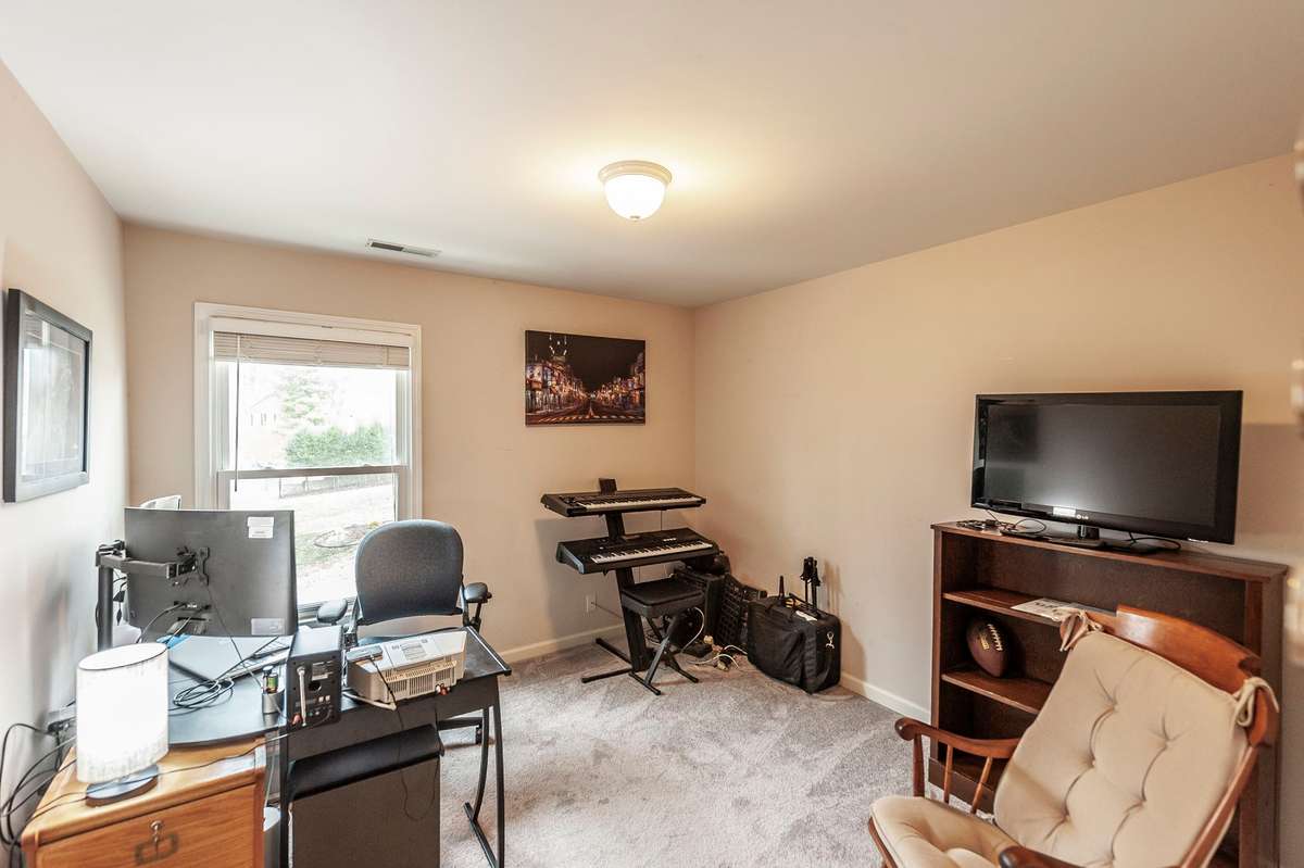 This bedroom off the Bonus Room is currently being used as an office. Lakeviews are great from thsi room!