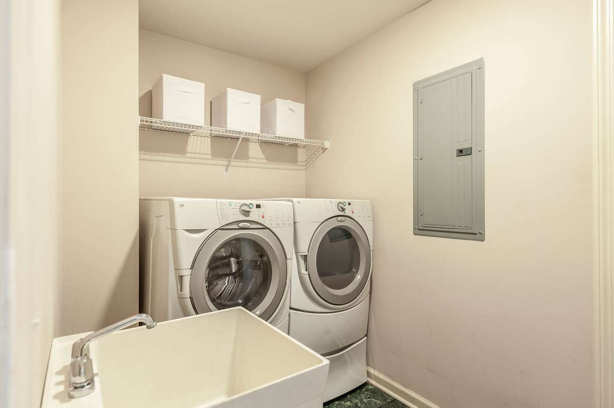 Laundry room with utility sink and access to everyones favorite... huge walk in attic storage!