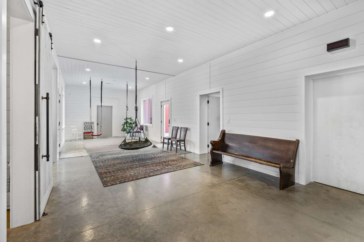 Breezeway/activity room.  Walk through this room to get to the barn without getting wet.