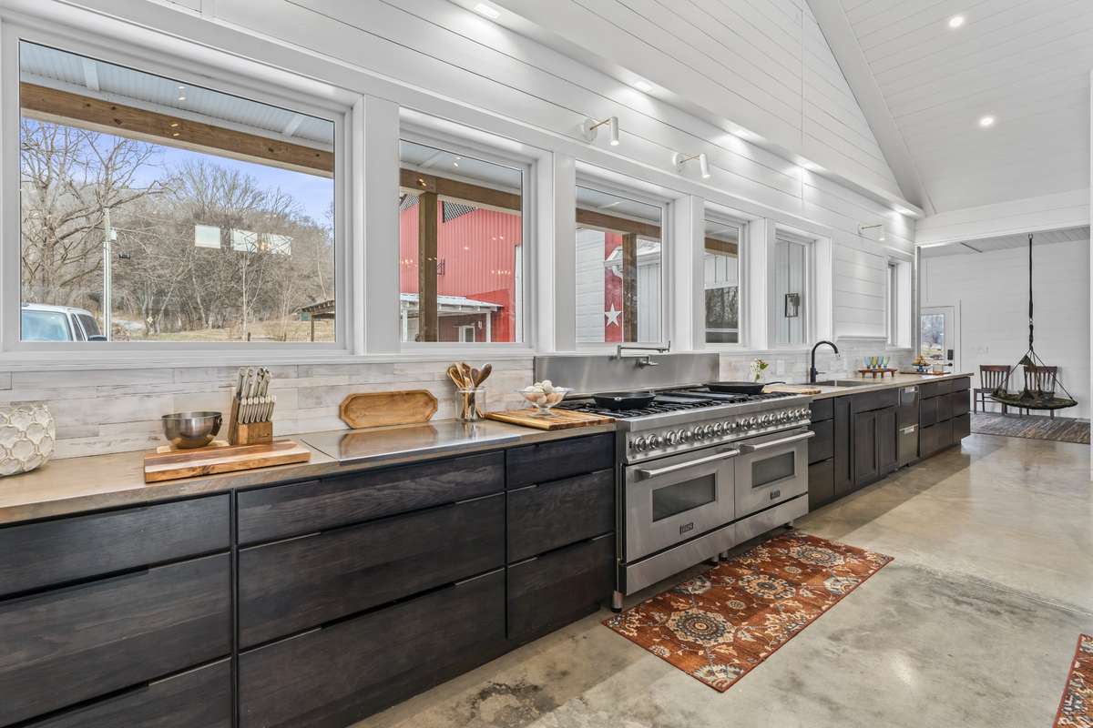 Two professional gas ranges with electric ovens