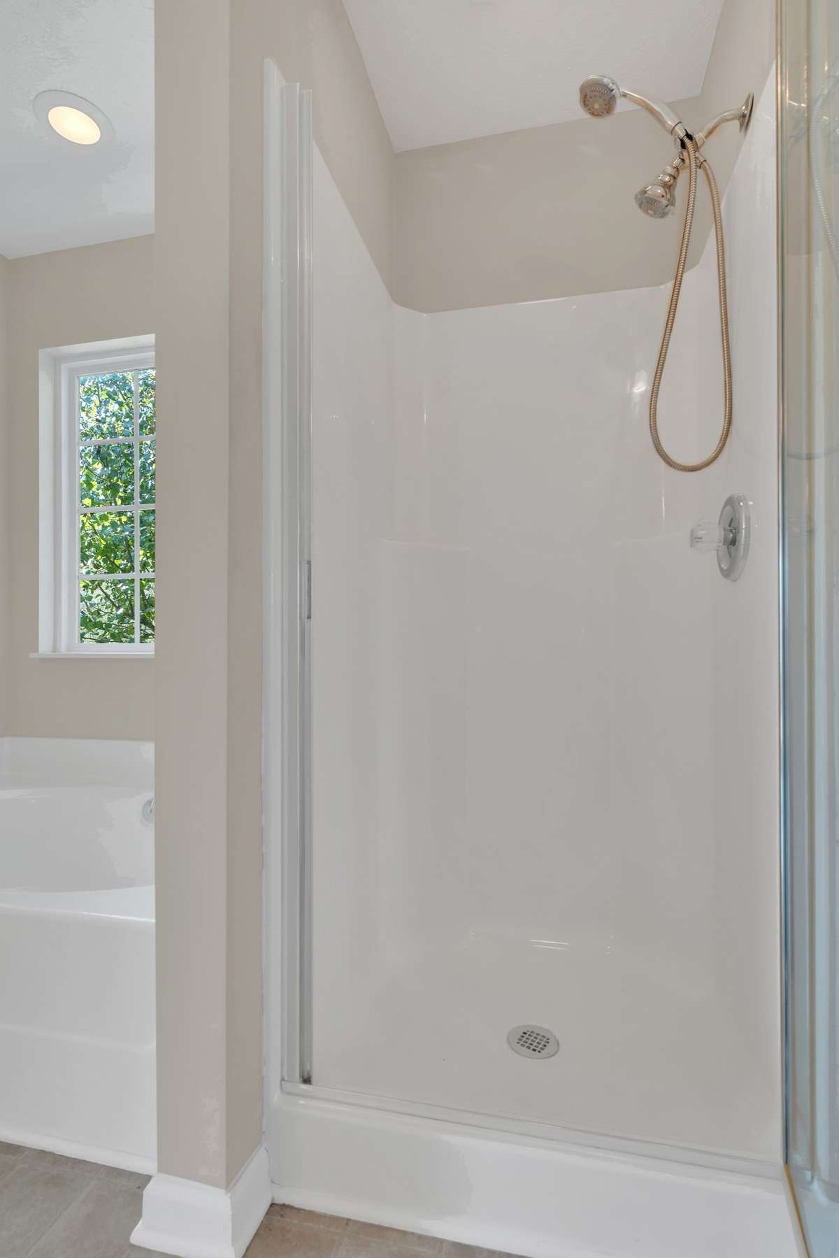 Separate shower (could easily be expanded by removing linen closet beside it).  And you still have tons of closet and cabinets pace!