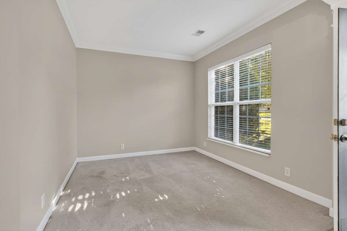 Formal living room located off the foyer could be easily closed off with French doors makes a great flex room . . . home office, playroom, music room, whatever you need!