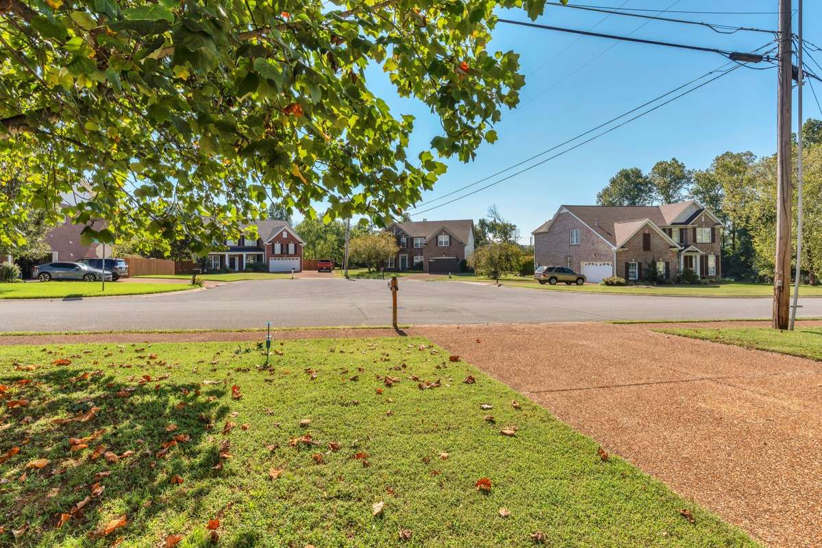 View from front yard  . .  short walk on sidewalk to community amenity are with pools, tennis, playground and more! Great cul-de-sac across the street for bike riding