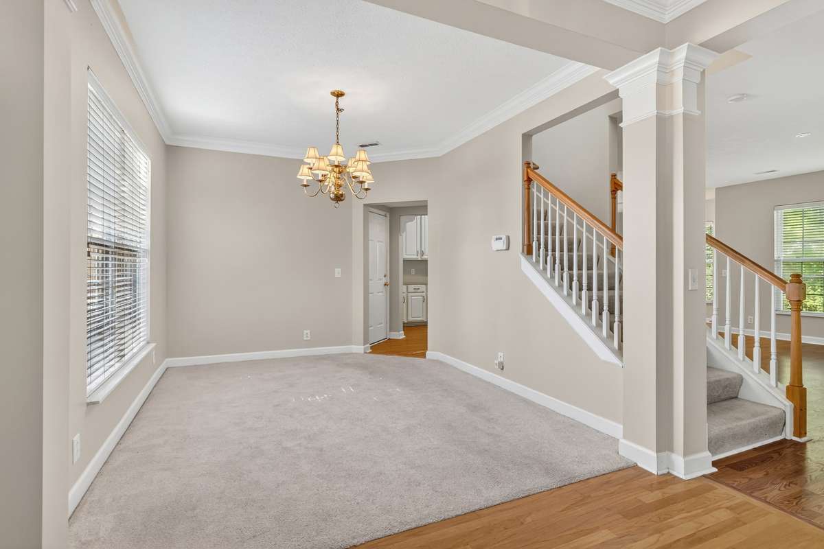 Formal dining room with double crown molding and wonderful windows overlooking front yard