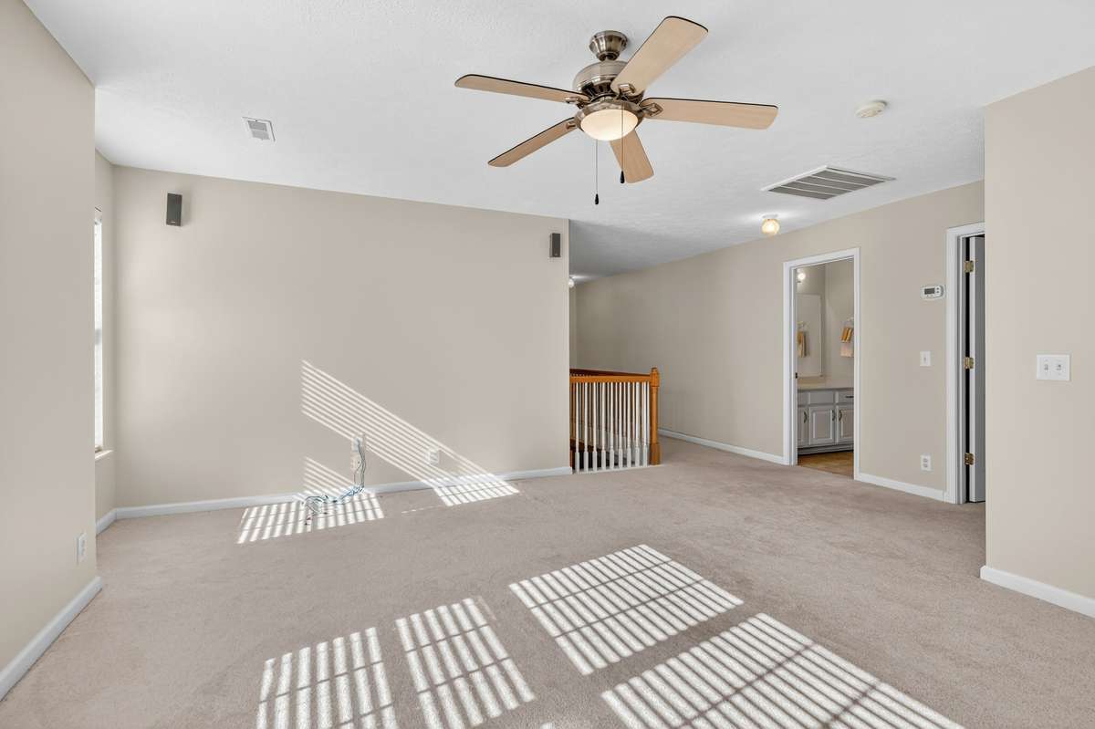 Upstairs bonus room with ceiling fan and surround sound speakers.  Two HVAC units . . .one for upstairs and one for downstairs