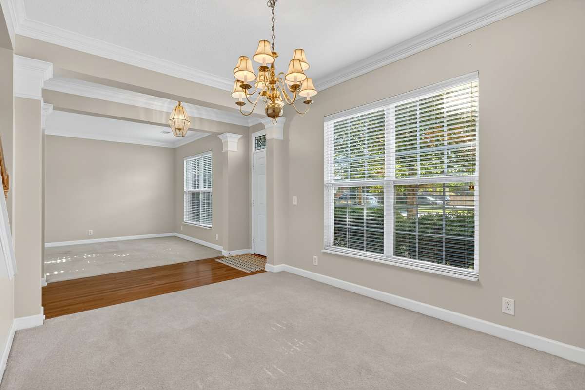 View from dining room looking towards foyer and into formal living room/flex room