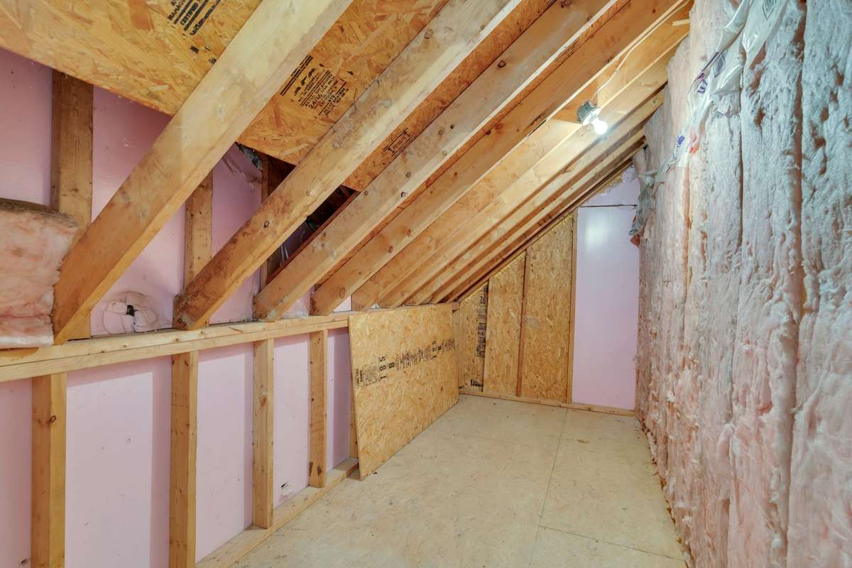 Unfinished storage room located off the laundry room. . . definitely not lacking for storage space in this home