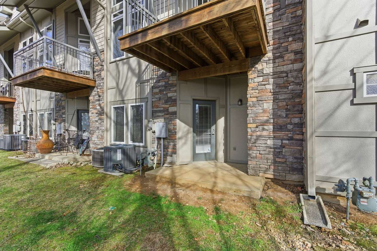 Enjoy a second outdoor living area — a private porch with serene, wooded views.
