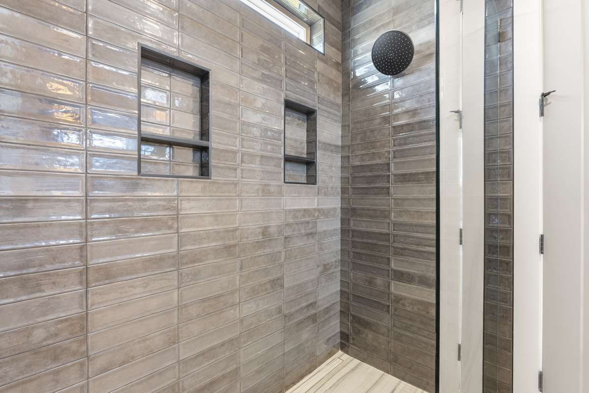 Interior photos are from Unit 100 and highlight the craftsmanship, finishes, and design buyers can expect.