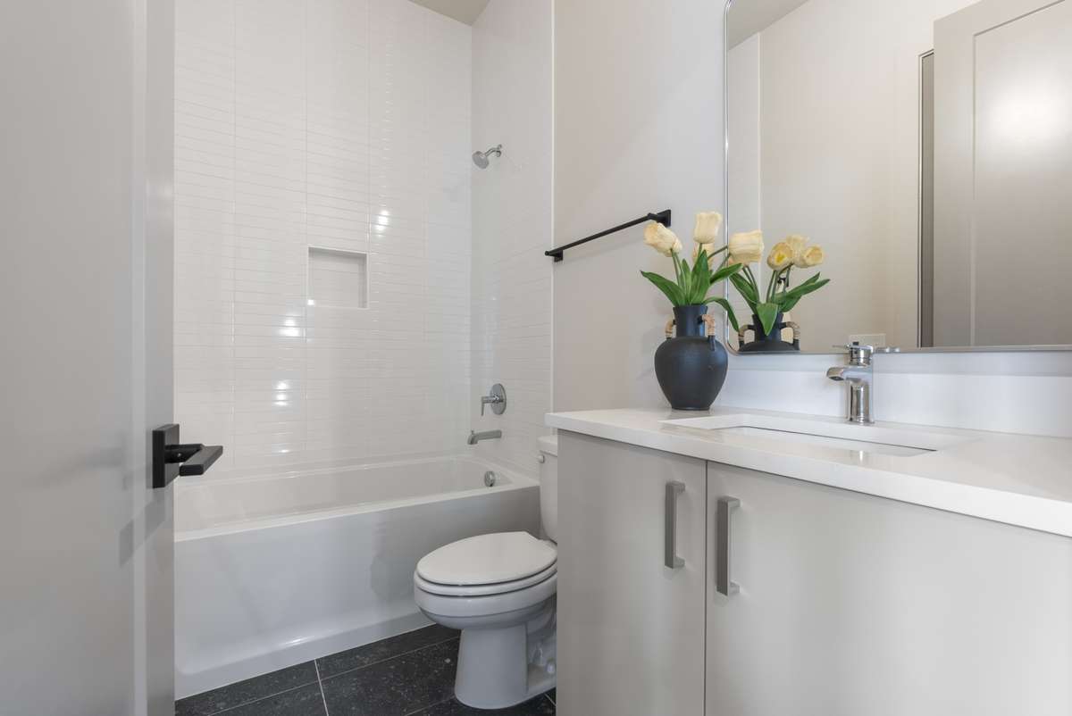 Interior photos are from Unit 100 and highlight the craftsmanship, finishes, and design buyers can expect.