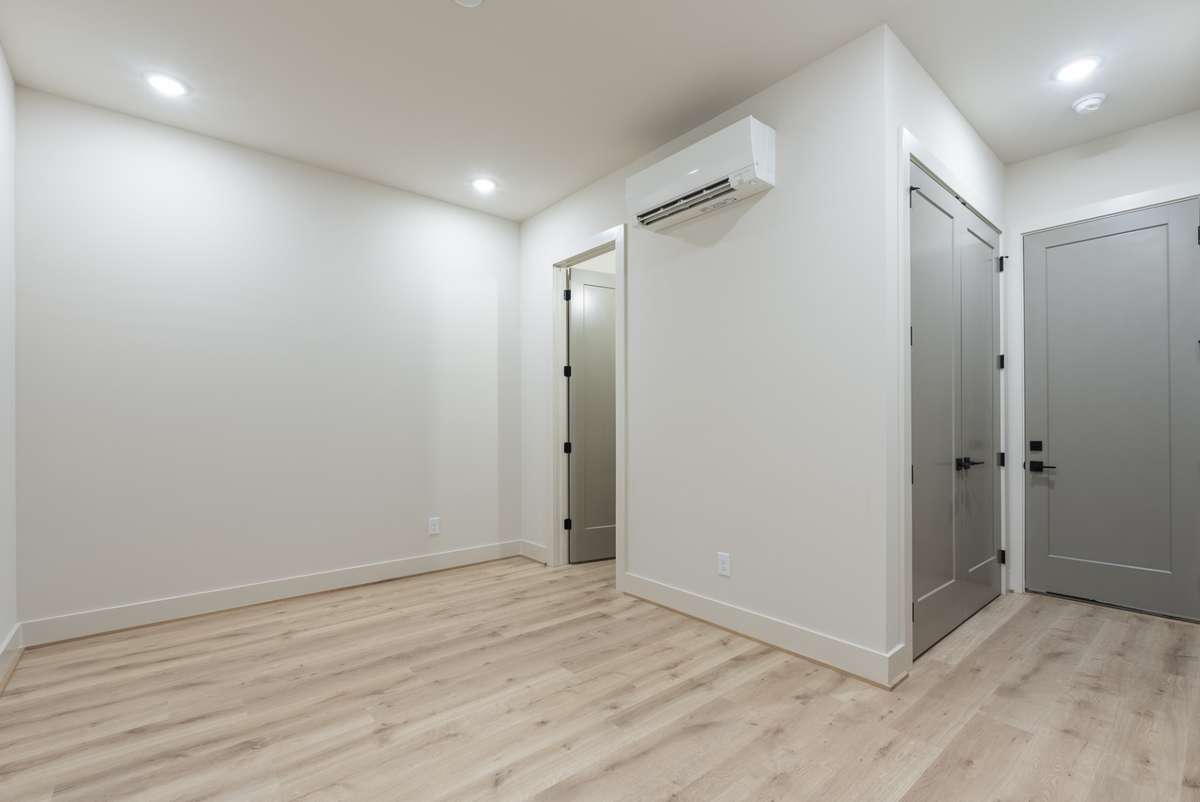 Interior photos are from Unit 100 and highlight the craftsmanship, finishes, and design buyers can expect.