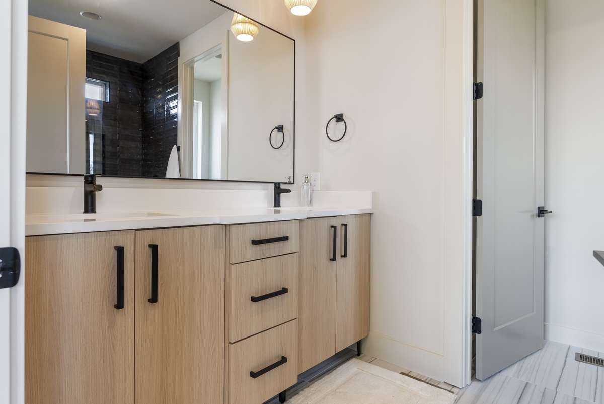 Interior photos are from Unit 100 and highlight the craftsmanship, finishes, and design buyers can expect.