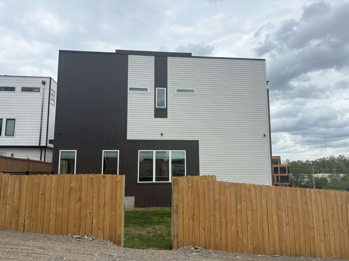 In addition to garage and driveway parking, a rear parking area offers added convenience for guests and overflow, though it is not designated and may be reserved for future enhancements.