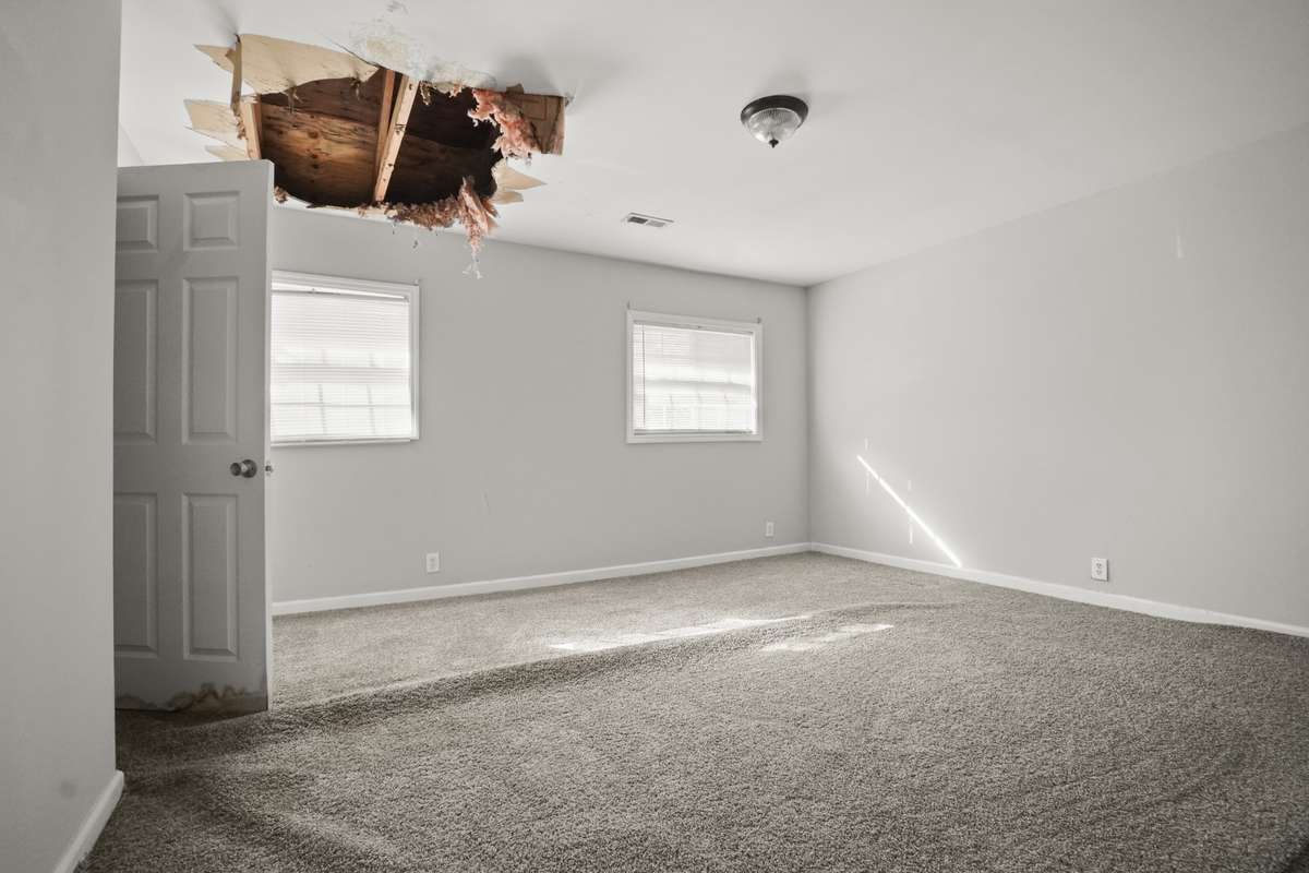 Primary bedroom currently has hole in ceiling from previous roof leak. Roof has been repaired. Hole in ceiling has not yet been repaired since new roof was installed.