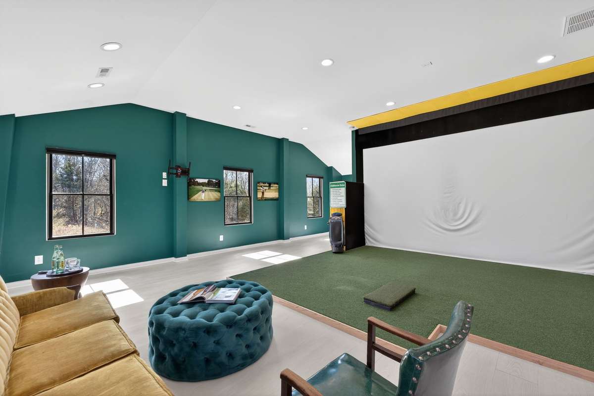 Extra large Bonus Room Upstairs with Golf Simulator set up. See Listing for details