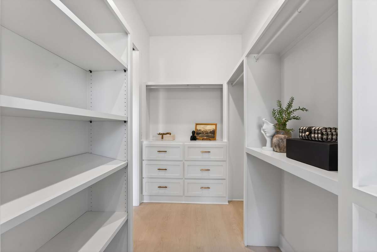 Her Closet with built in Shoe Rack and Dresser