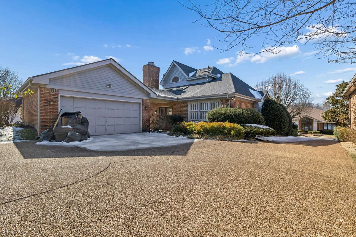 Deep 2 car detached garage with large driveway