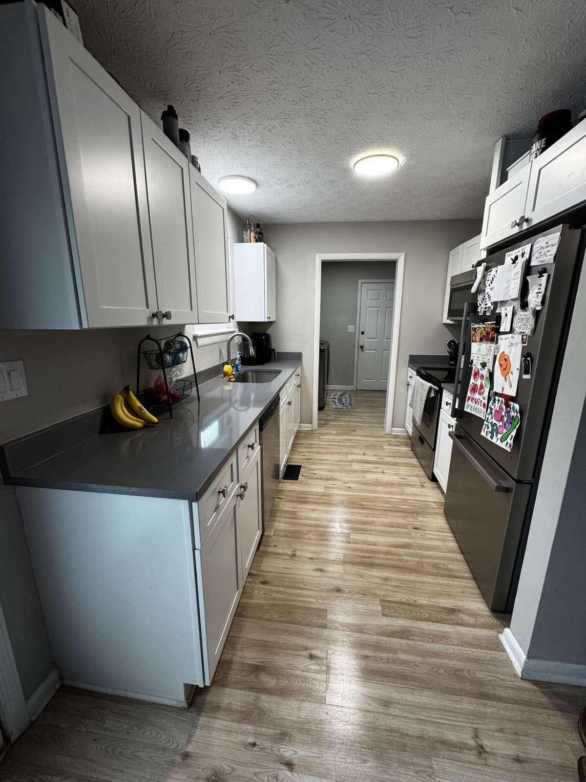 Kitchen w/Quartz Countertops and Stainless Appliances