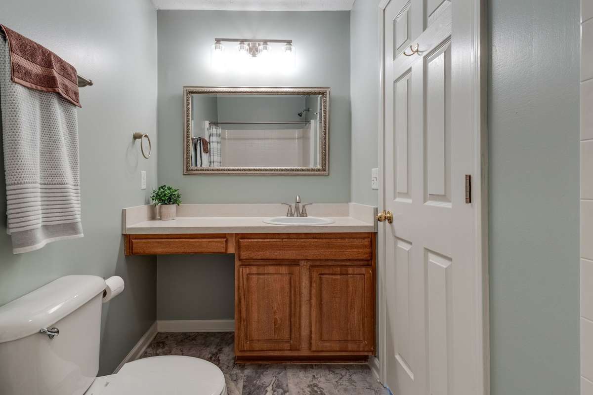 The primary en-suite has updated flooring and a vanity with knee space.