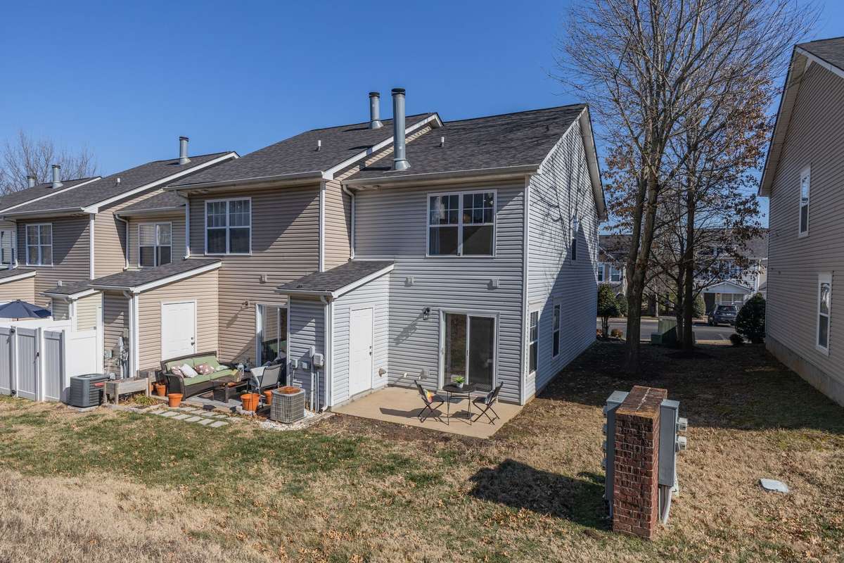 The patio backs to a hill, offering natural privacy. The end unit has the advantage of separation, and extra natural light with additional windows.