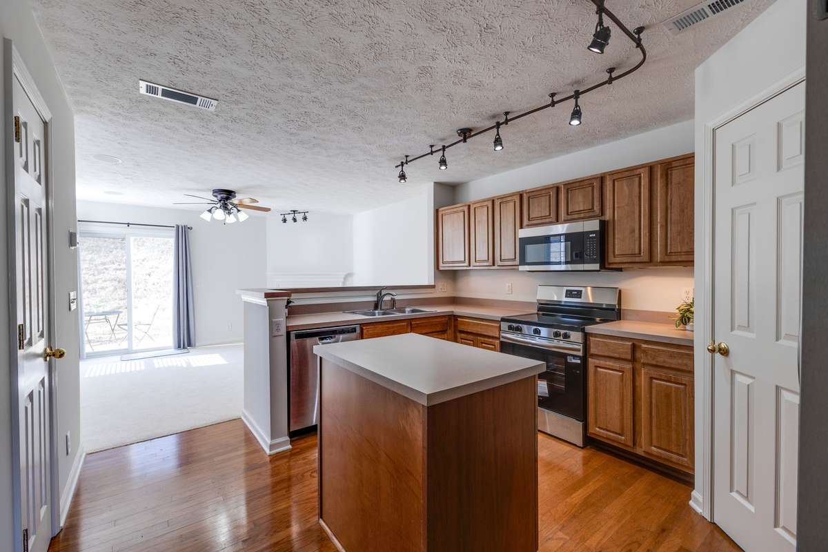 This large kitchen has ample cabinet space, NEW stainless steel appliances and a huge pantry.
