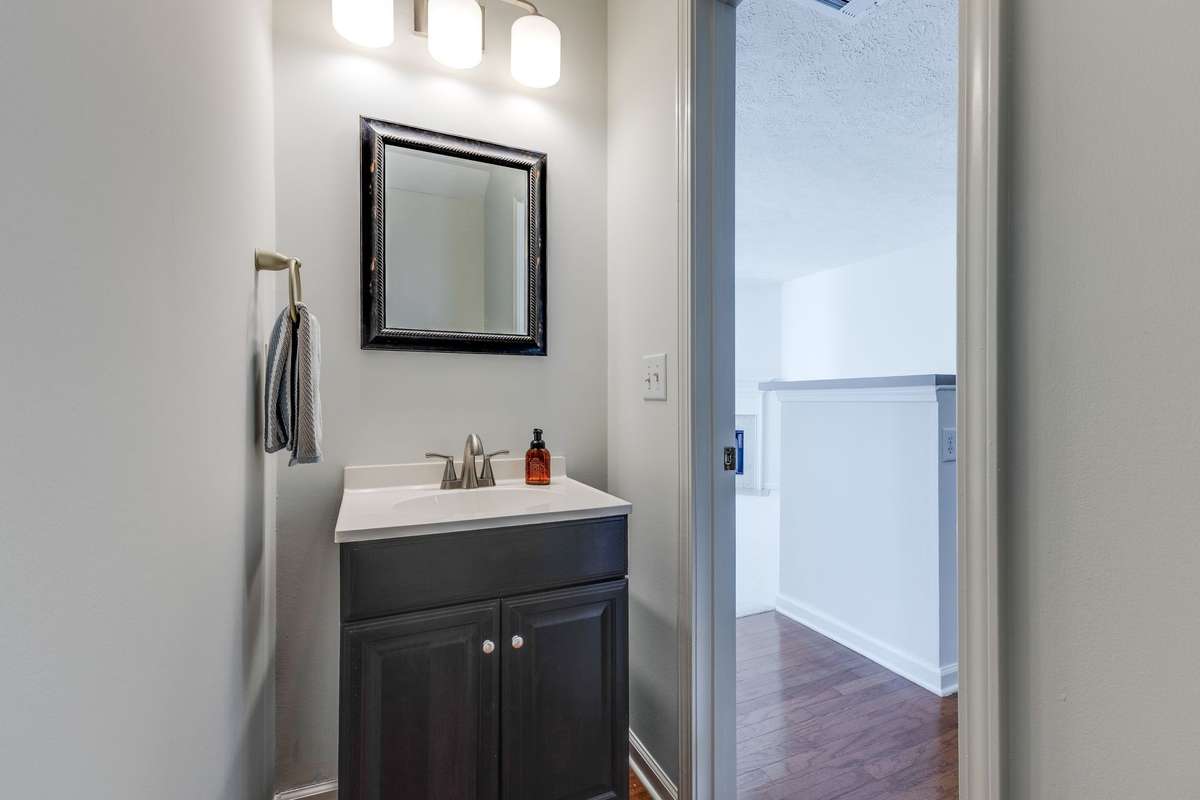 The powder bath offers a small vanity - an upgrade from a pedestal.