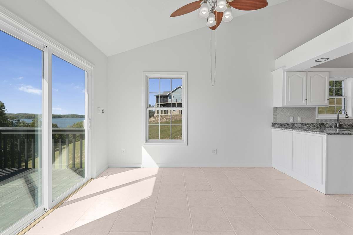 Additional view of dining room overlooking the lake