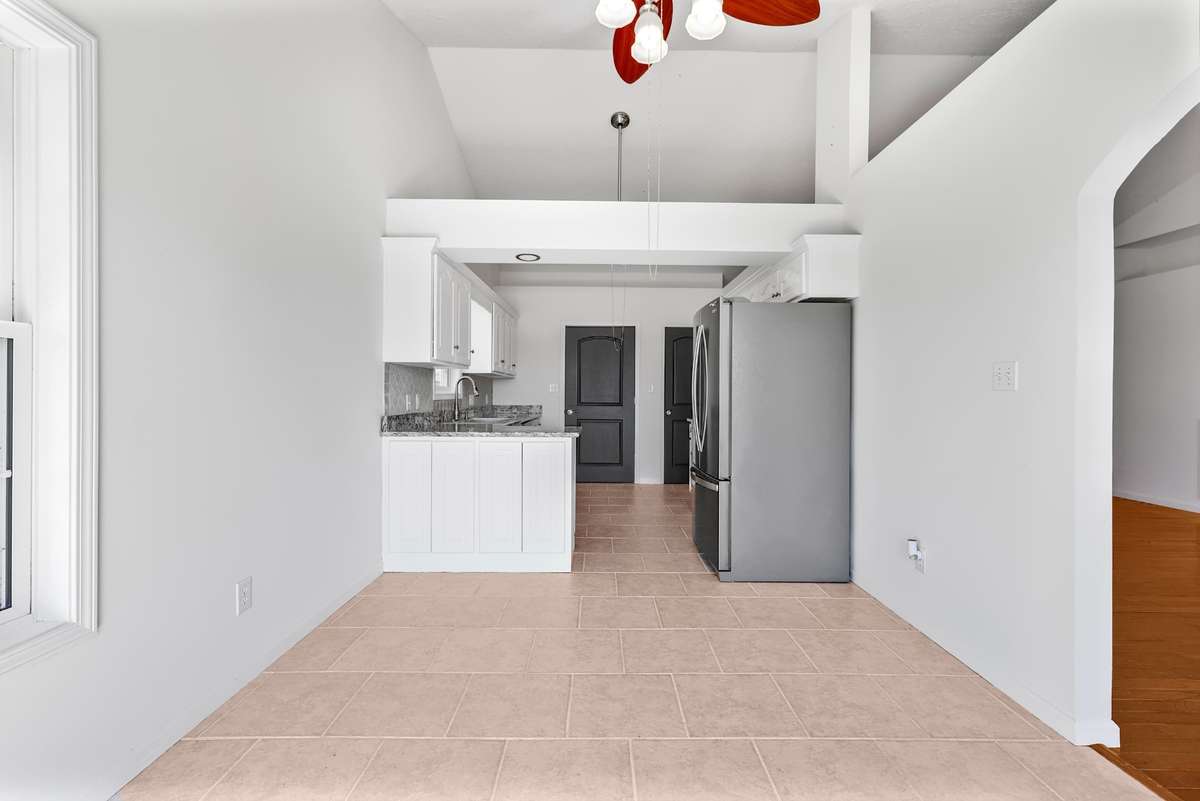 Primary dining room with open flow to kitchen.