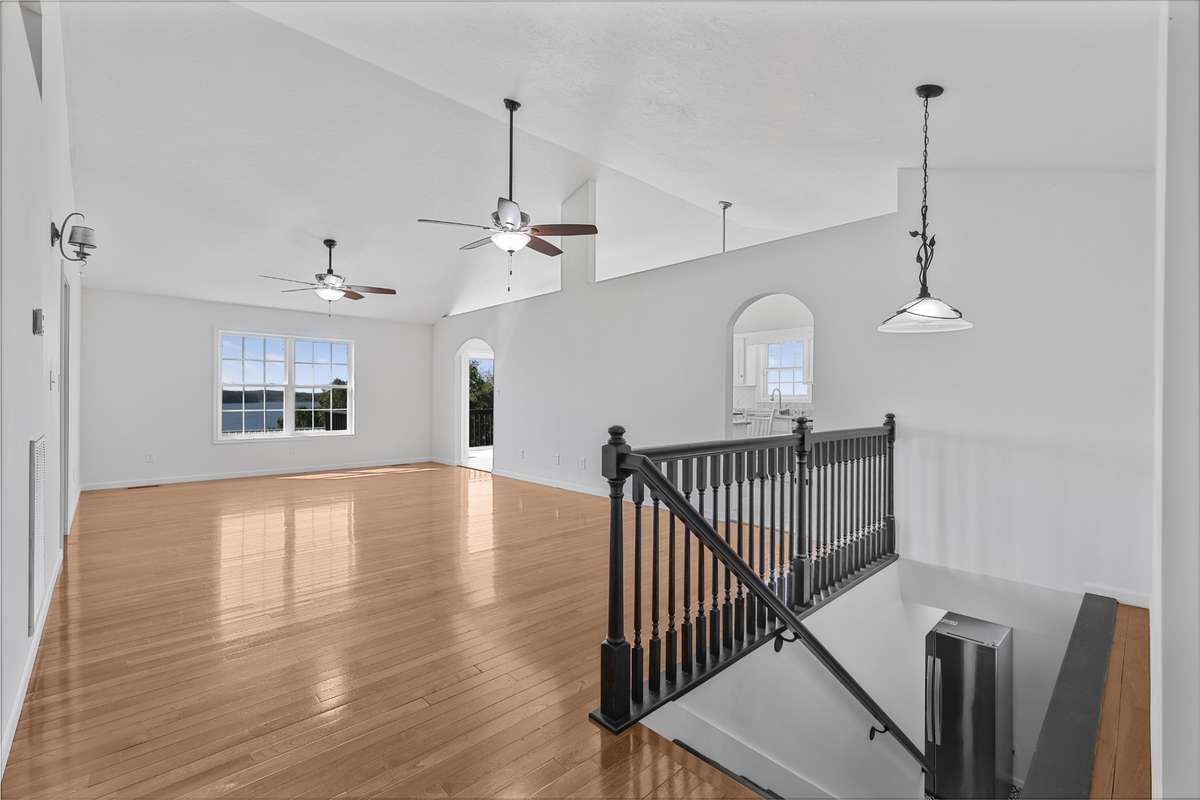 Open main living area with hardwood floors and natural light