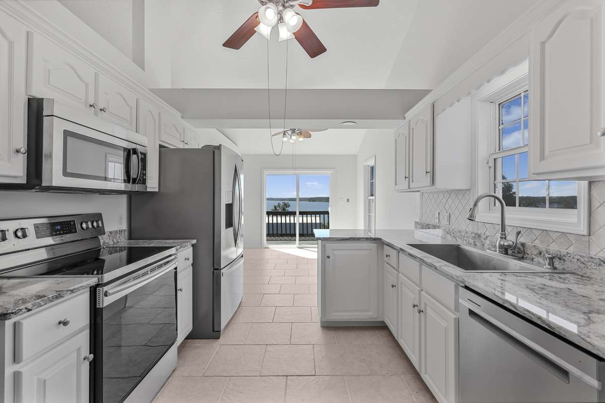Primary kitchen is bright with generous counter space and open flow.